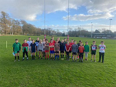 Year 5 and 6 children enjoying themselves in the rugby and hockey tournament